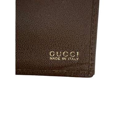 Gucci brown bifold wallet smooth leather with iconic logo and vintage craftsmanship.
