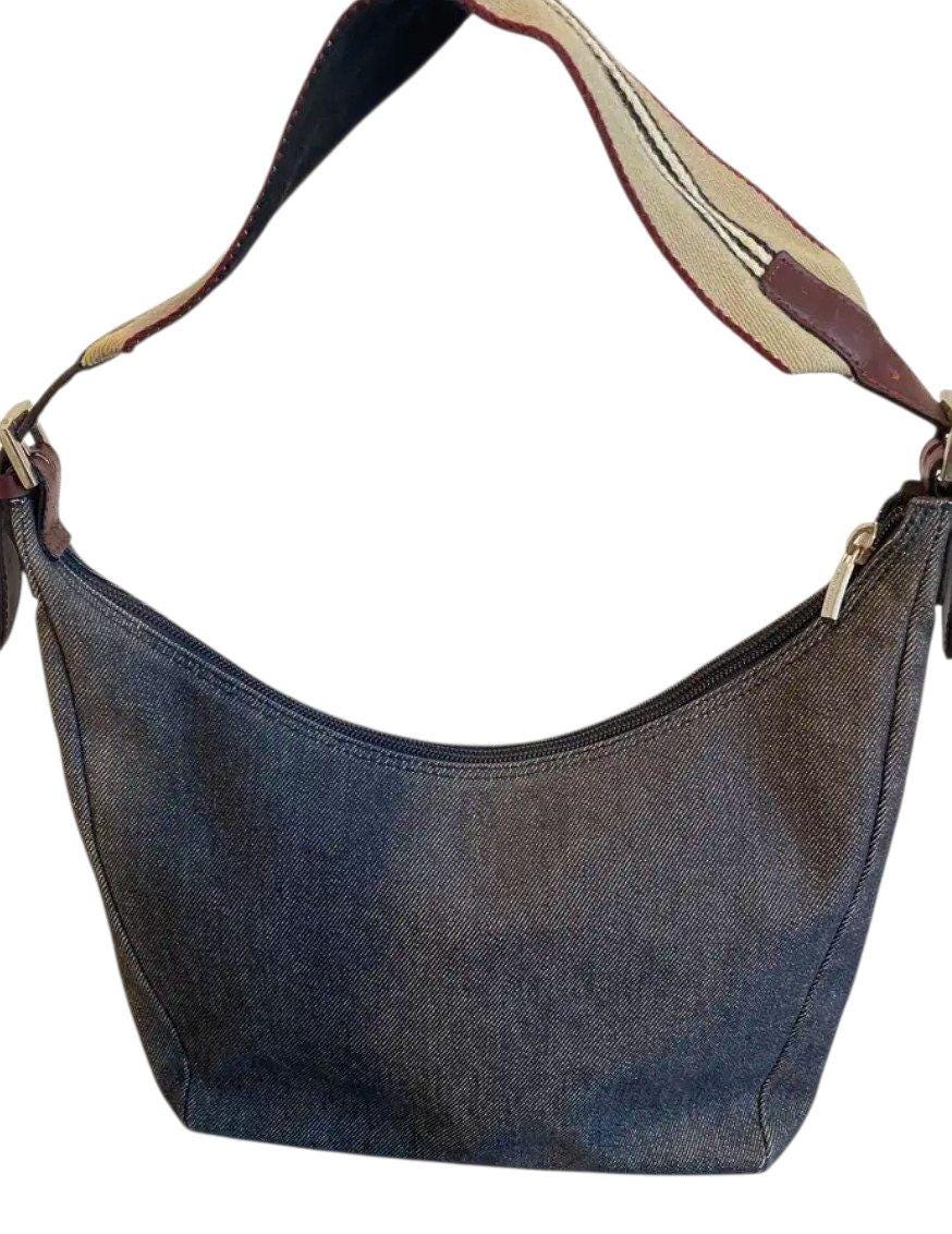 Burberry blue denim shoulder bag with leather trim and polished metal hardware.