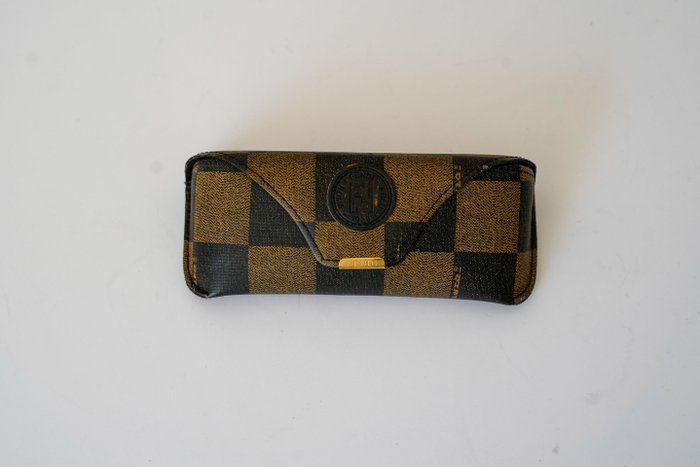 Fendi black and gold sunglasses with logo detail, high-quality plastic and metal frame.