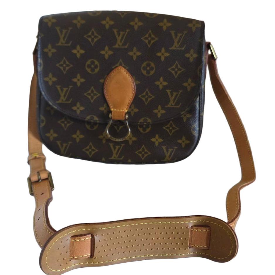 Louis Vuitton messenger bag gold monogram canvas with honey-hued Vachetta leather trim.