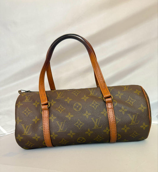 Louis Vuitton cylindrical handbag brown monogram canvas with natural cowhide leather straps.