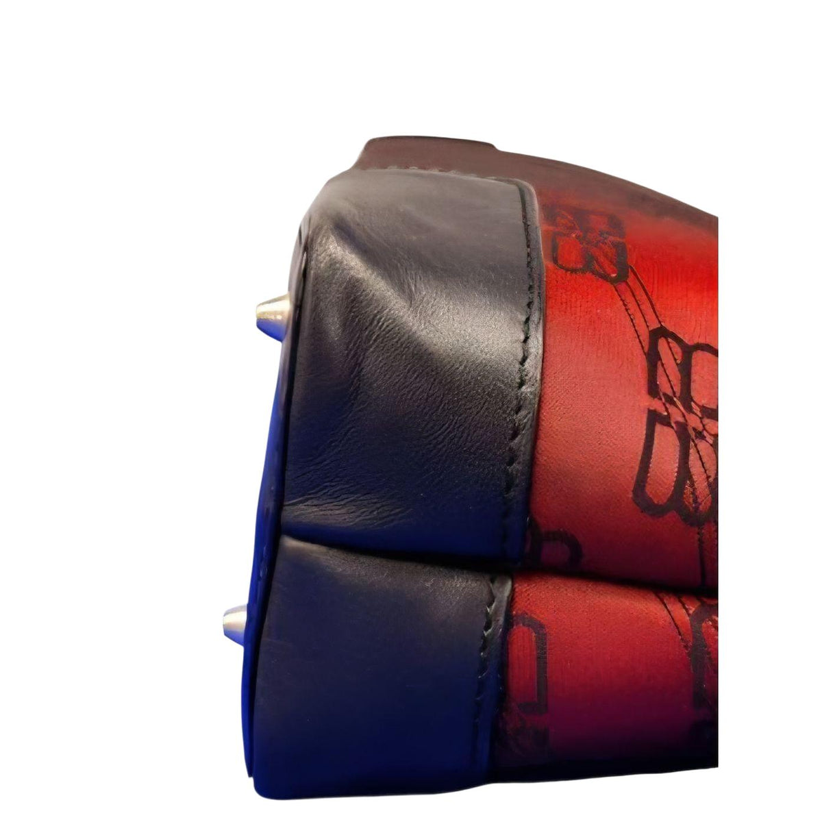 Balenciaga black and red shoulder bag with signature monogram and adjustable strap.