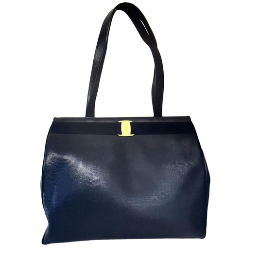 Salvatore Ferragamo blue handbag with gold-tone hardware and signature monogram lining.