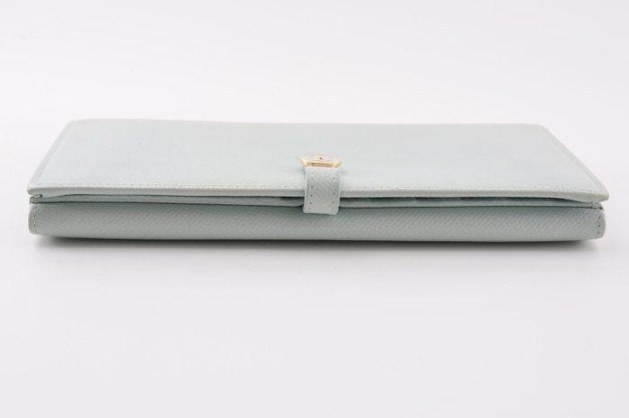 Chanel blue leather wallet with logo detail and minimalist design, featuring light scuffs.