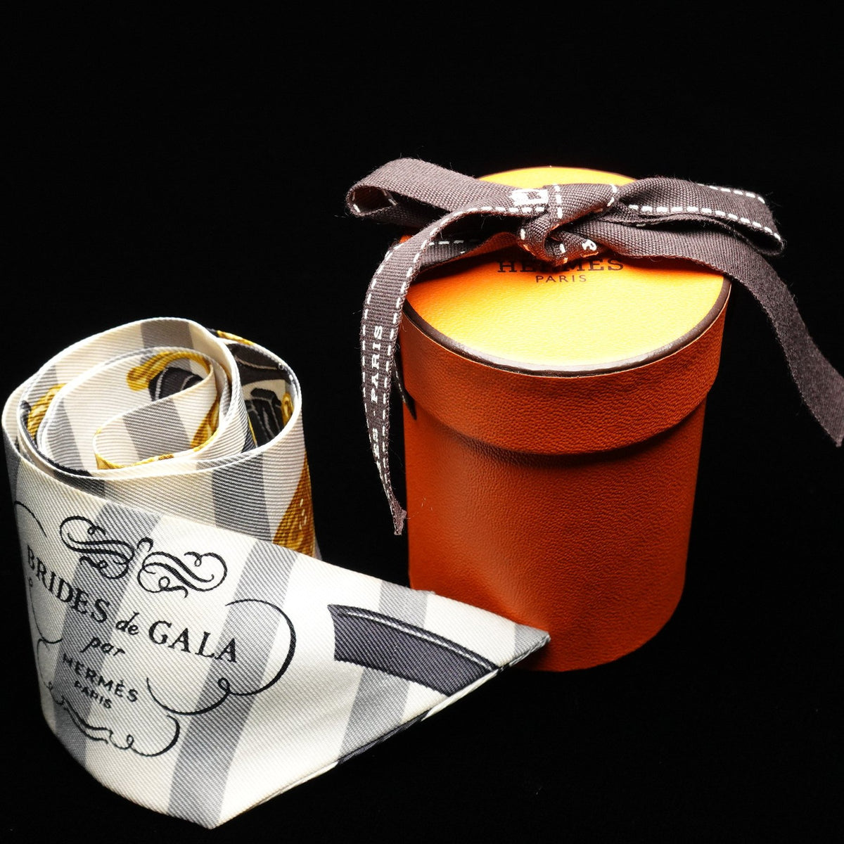 Hermès Twilly “Brides de Gala Bayadère” White and Yellow Silk Scarf