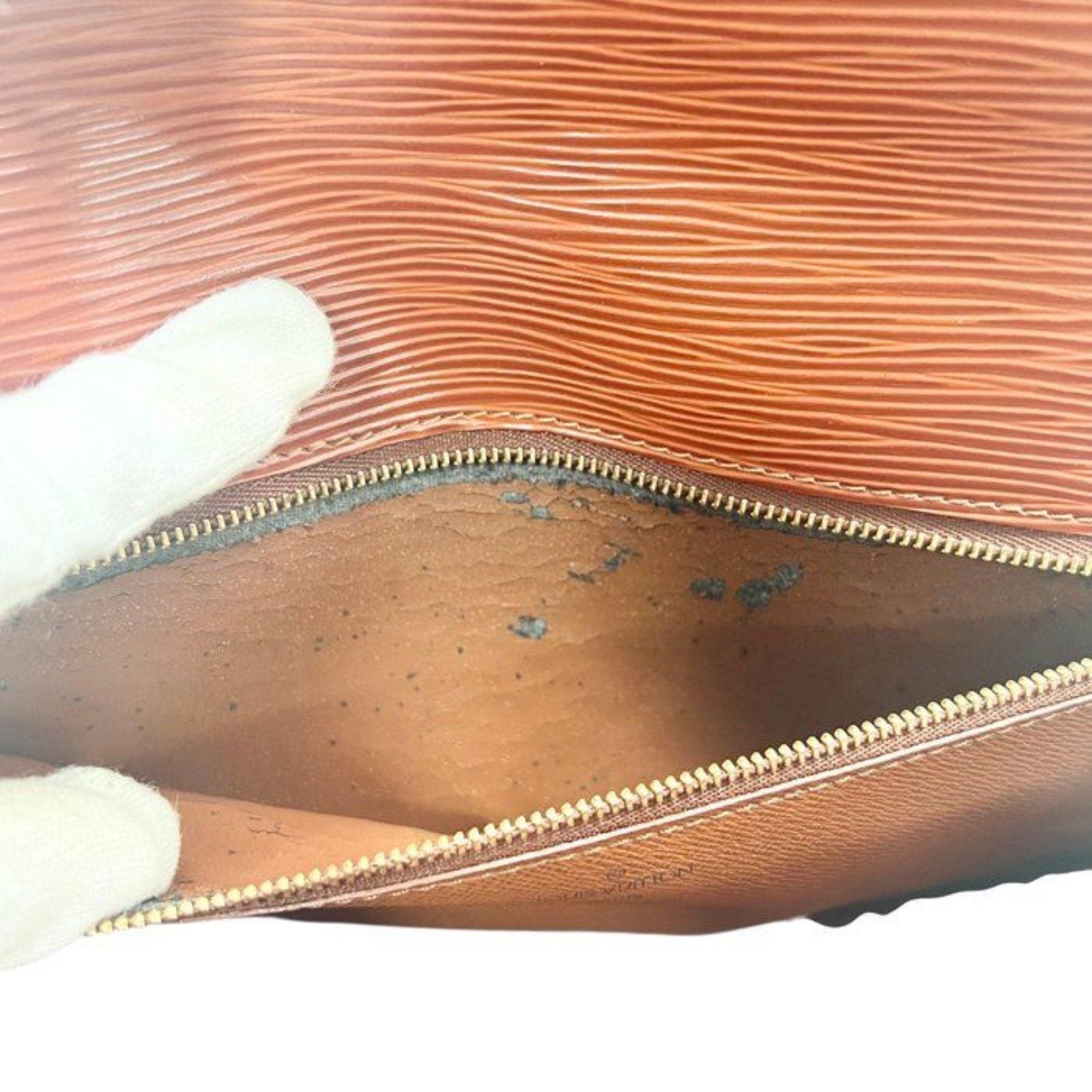 Louis Vuitton brown Epi leather pochette bag with gold hardware and textured finish.