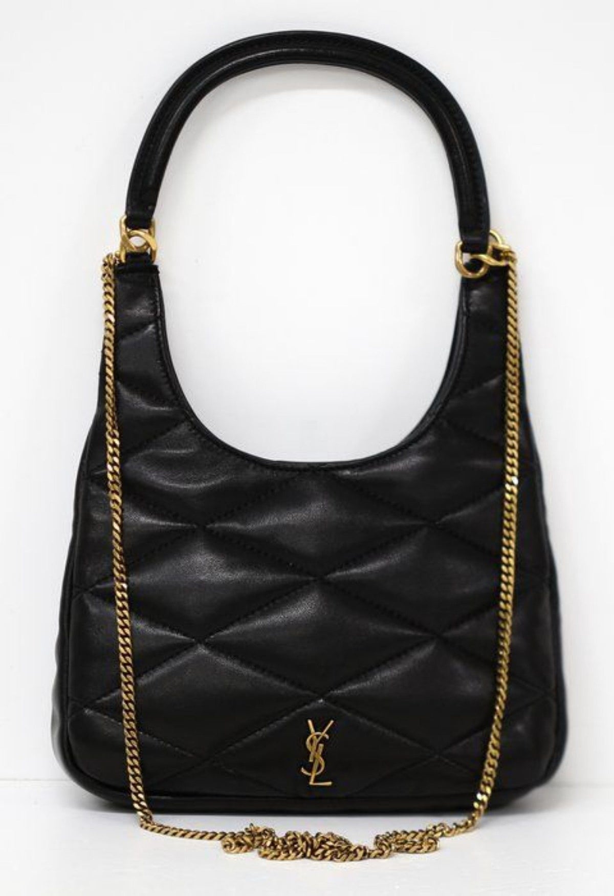 Saint Laurent black hobo bag diamond quilted lambskin with gold Cassandre logo.