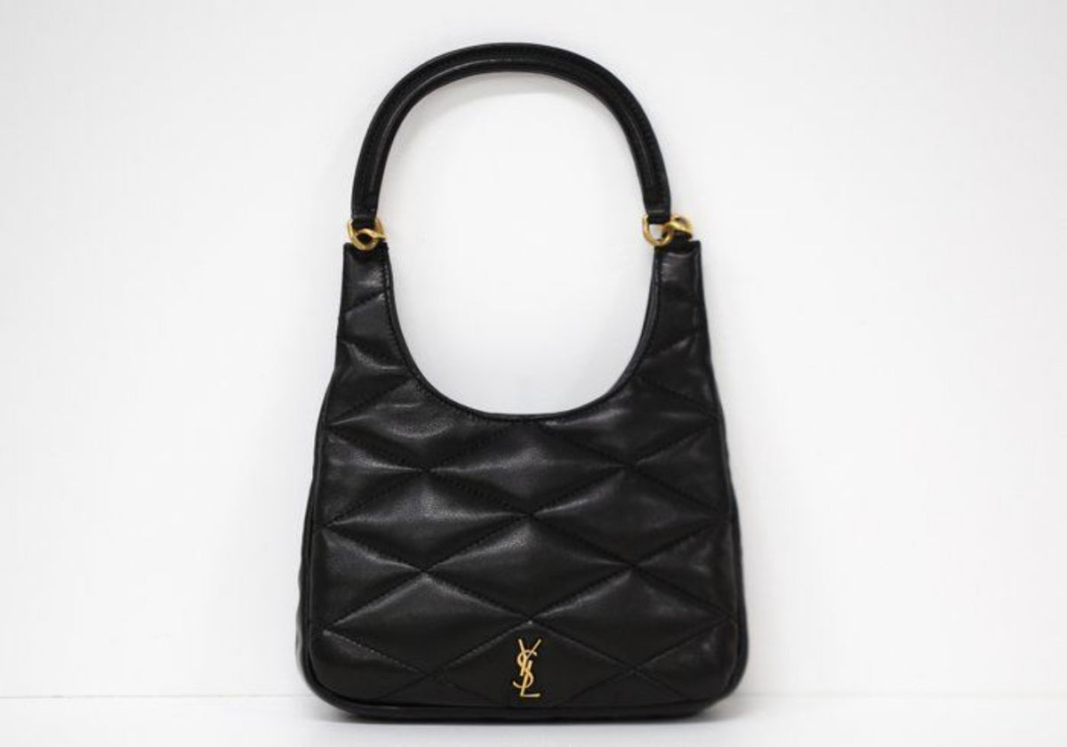 Saint Laurent black hobo bag diamond quilted lambskin with gold Cassandre logo.