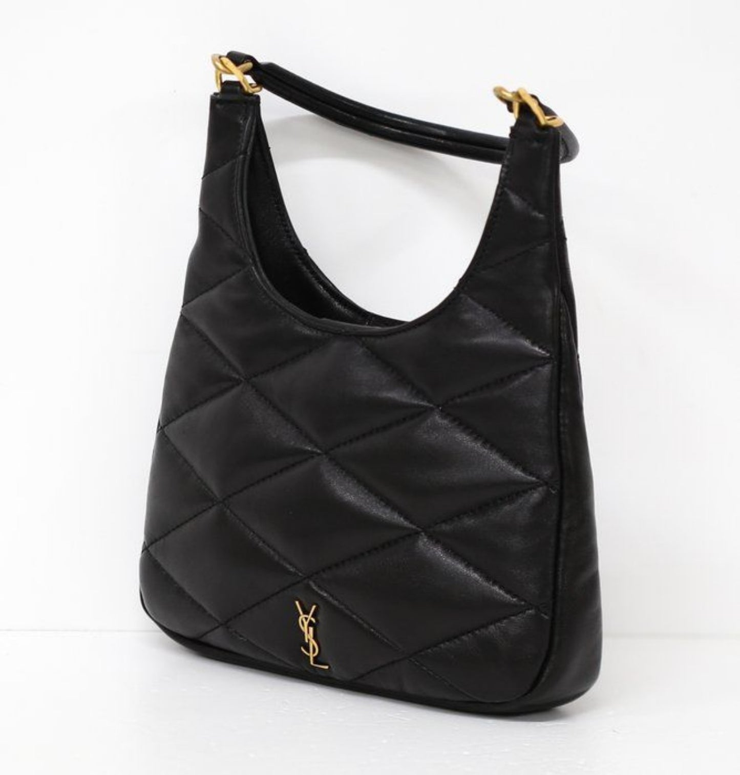 Saint Laurent black hobo bag diamond quilted lambskin with gold Cassandre logo.