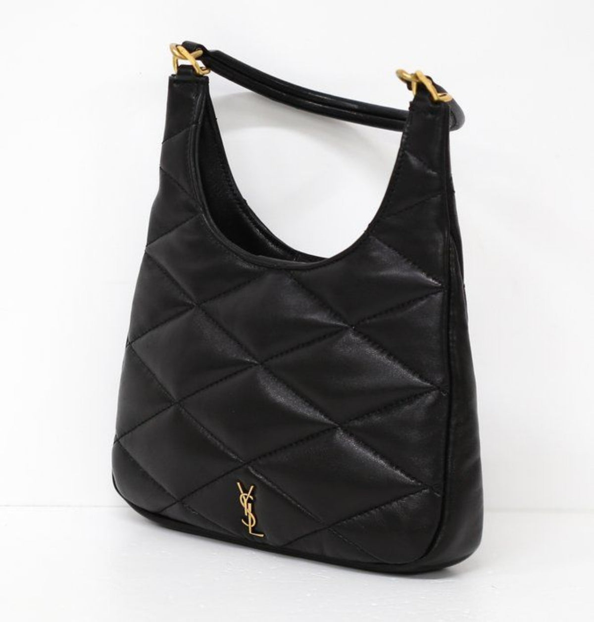 Saint Laurent black hobo bag diamond quilted lambskin with gold Cassandre logo.