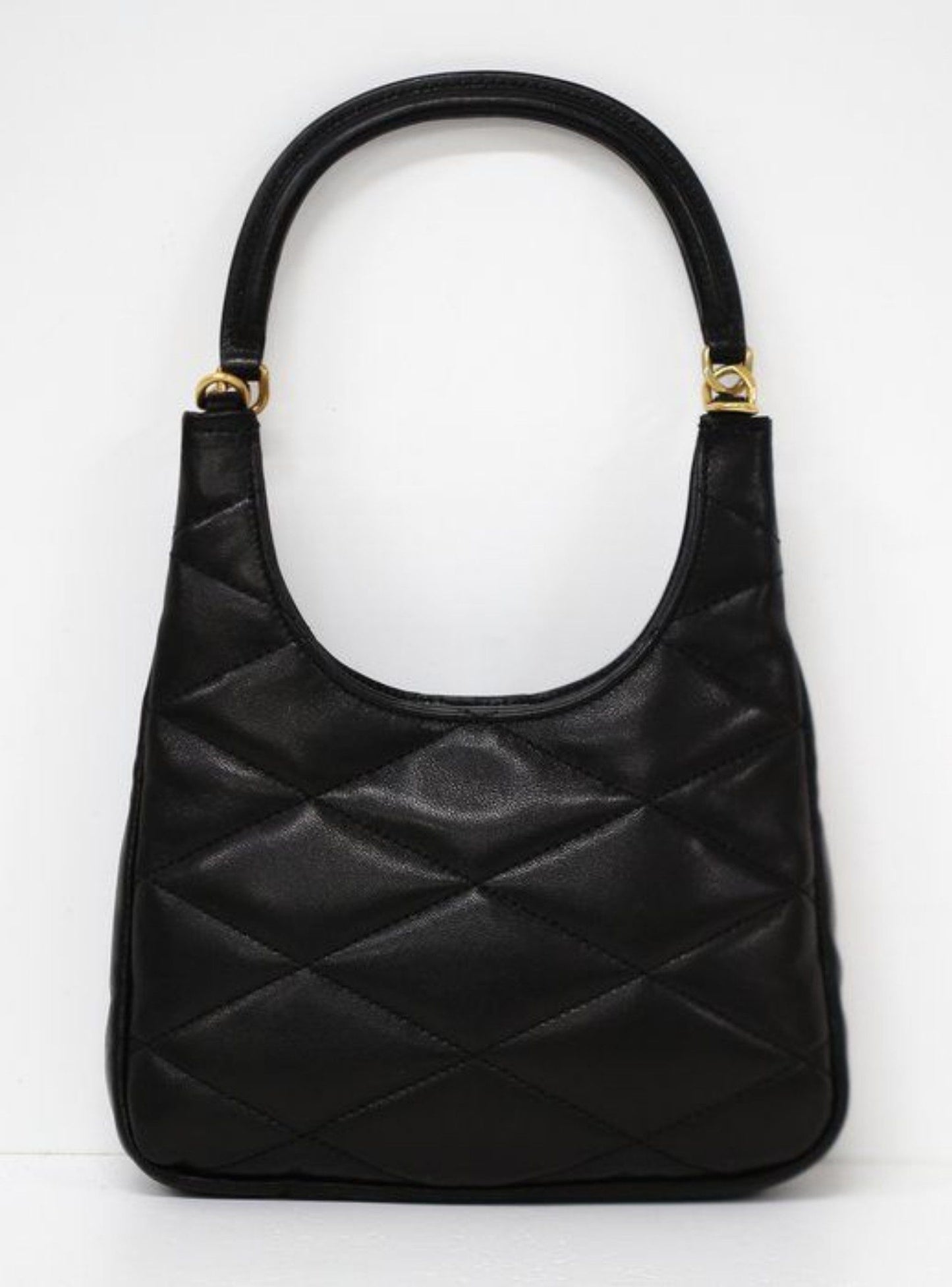 Saint Laurent black hobo bag diamond quilted lambskin with gold Cassandre logo.