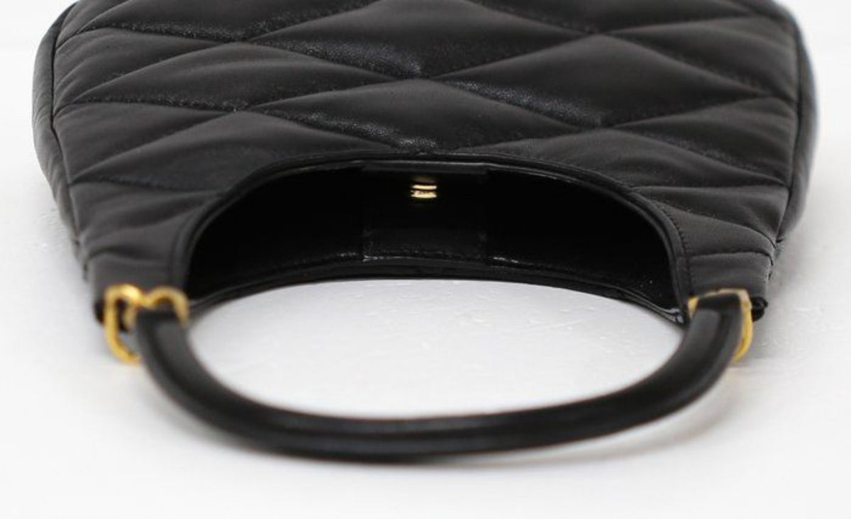 Saint Laurent black hobo bag diamond quilted lambskin with gold Cassandre logo.