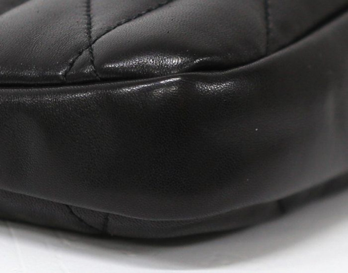 Saint Laurent black hobo bag diamond quilted lambskin with gold Cassandre logo.