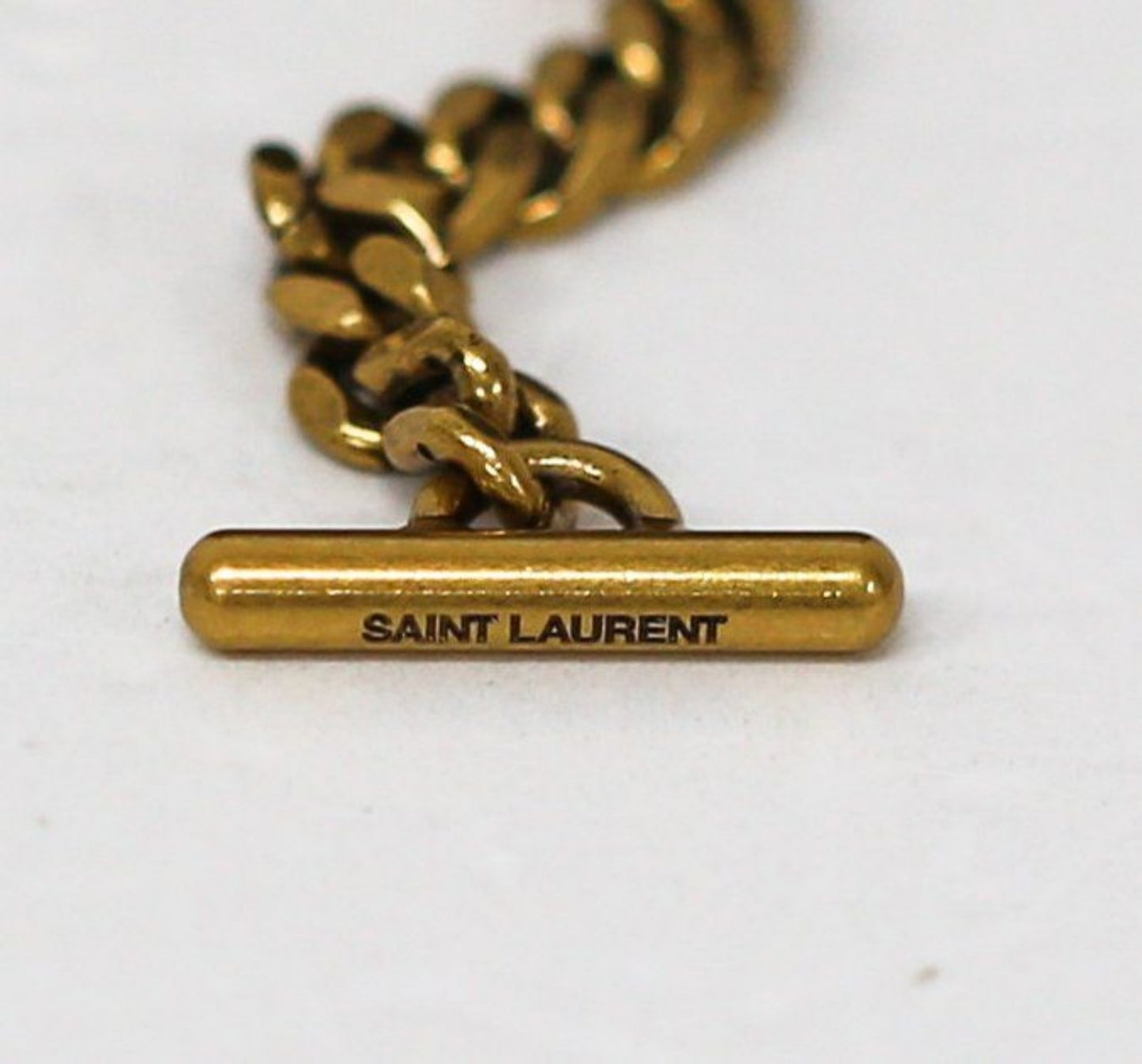 Saint Laurent black hobo bag diamond quilted lambskin with gold Cassandre logo.