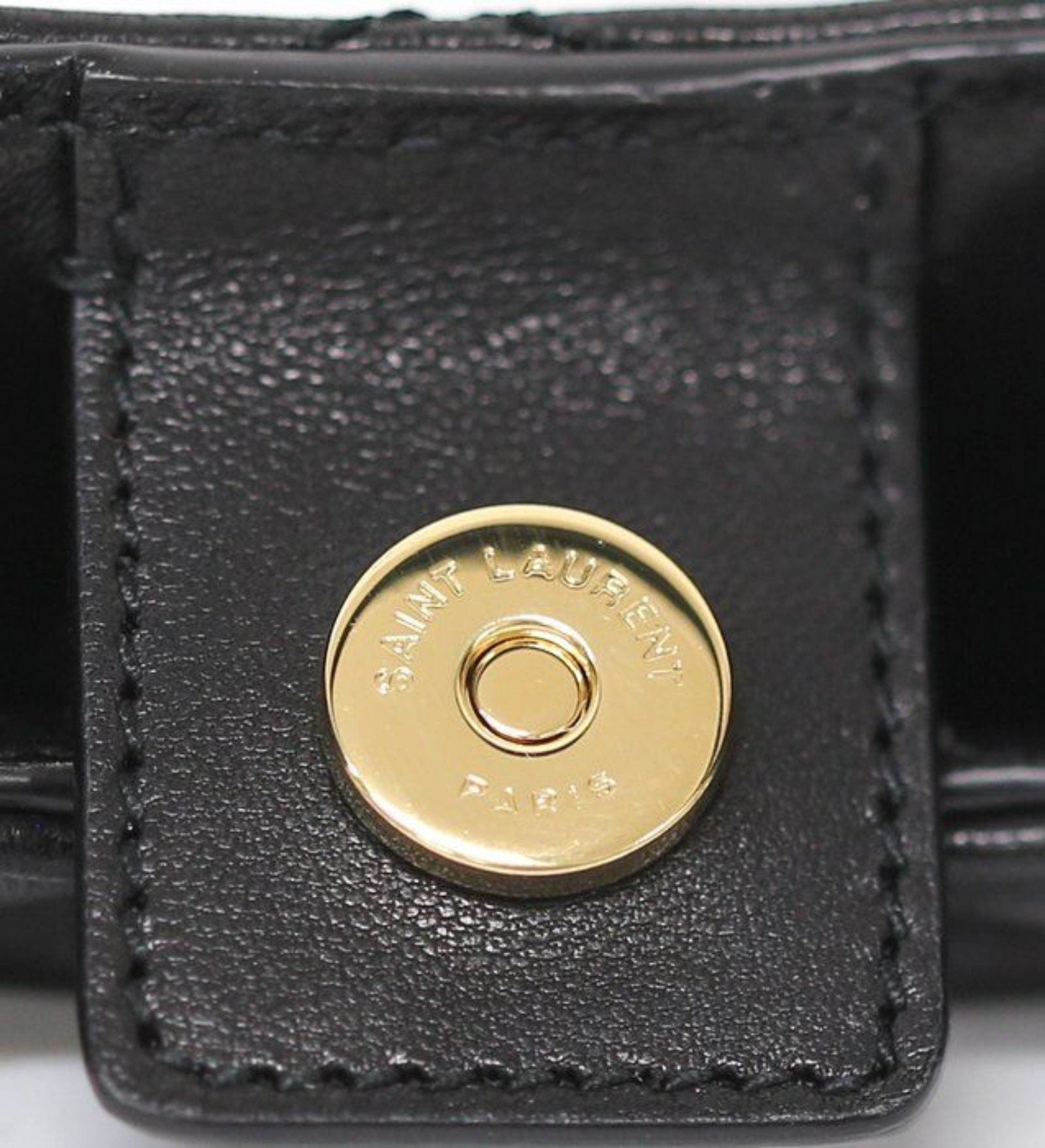 Saint Laurent black hobo bag diamond quilted lambskin with gold Cassandre logo.