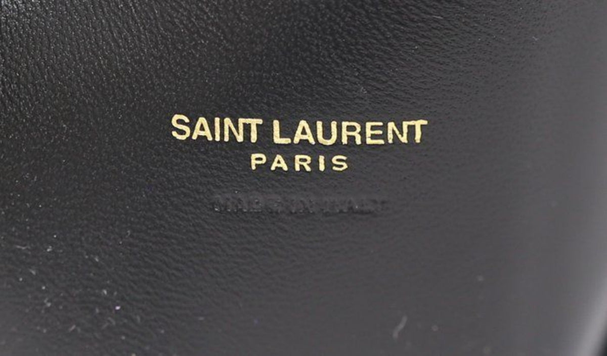 Saint Laurent black hobo bag diamond quilted lambskin with gold Cassandre logo.