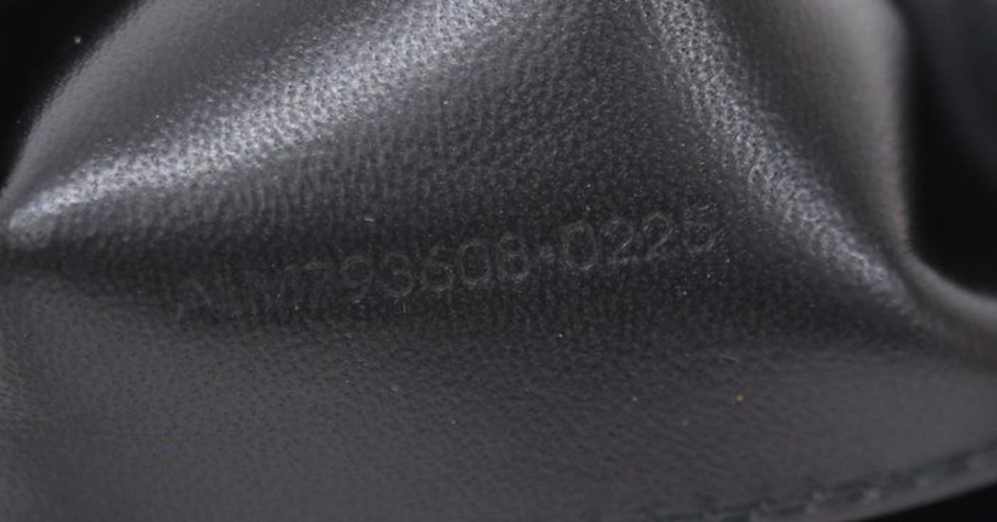 Saint Laurent black hobo bag diamond quilted lambskin with gold Cassandre logo.