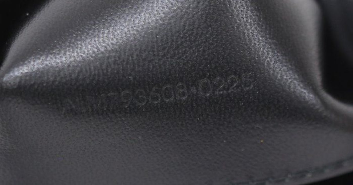 Saint Laurent black hobo bag diamond quilted lambskin with gold Cassandre logo.
